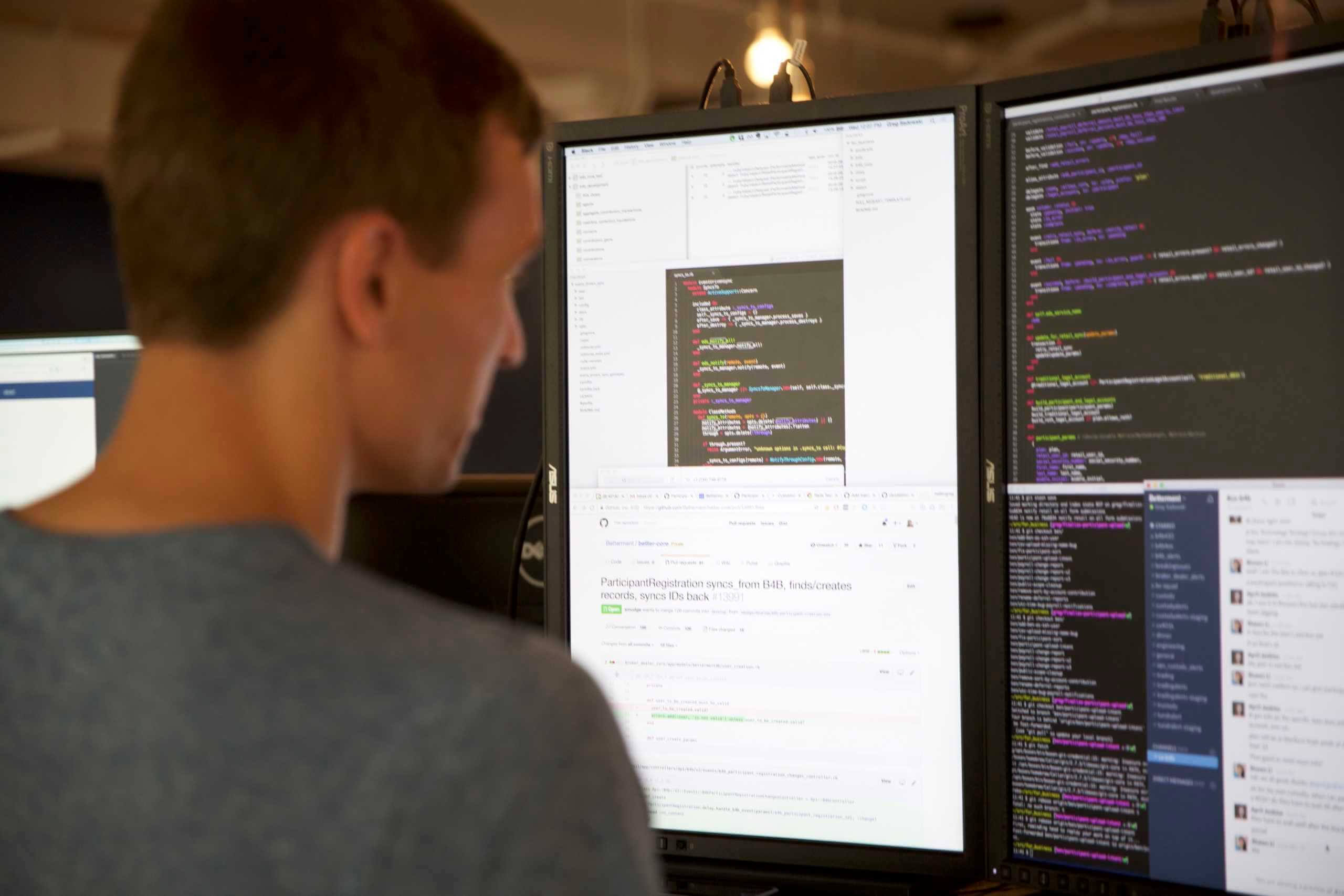 Engineer writing code on a computer monitor.
